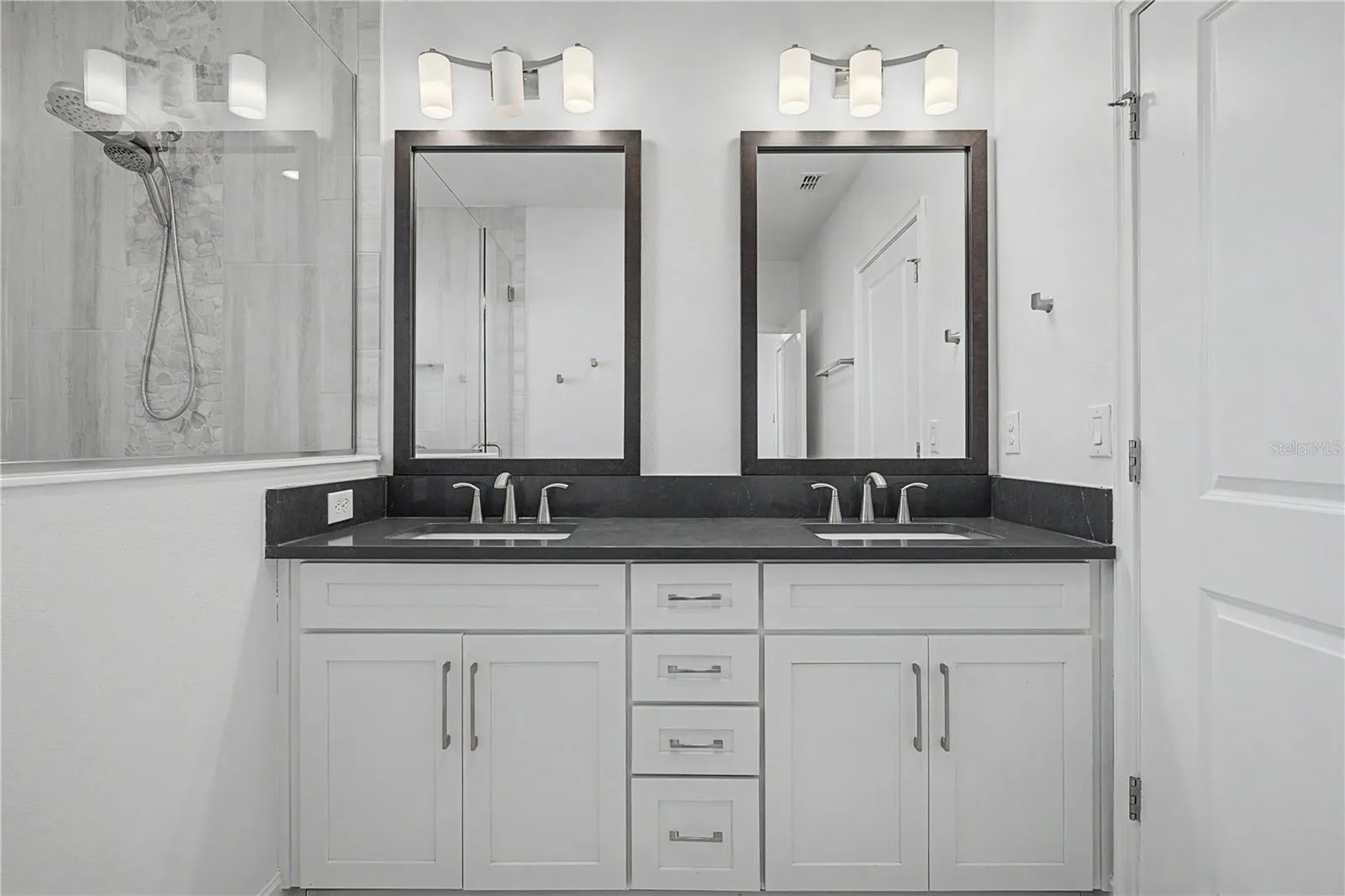 Third-level, master bath with double sinks.