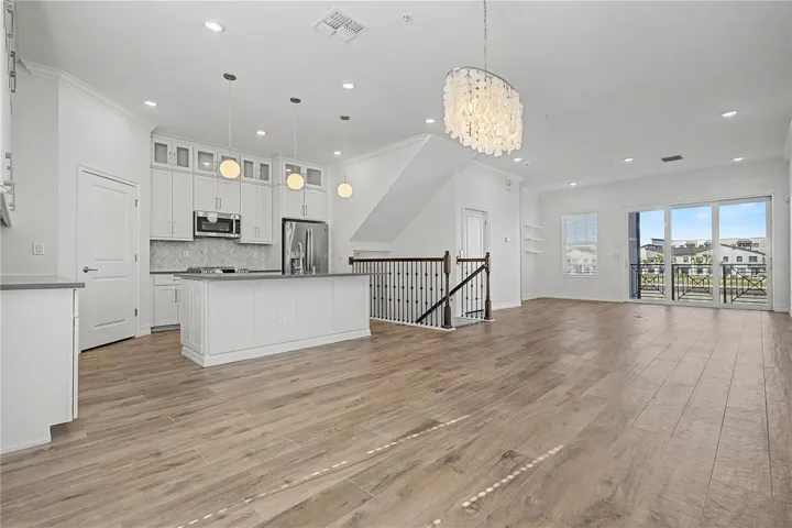 Second-level kitchen/dining  opening seamlessly to the living area.