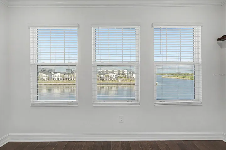 Third-level primary bedroom offering  beautiful water views.