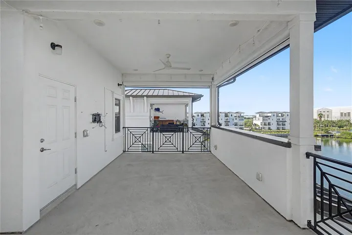 Fourth-level outdoor patio with large seating area.