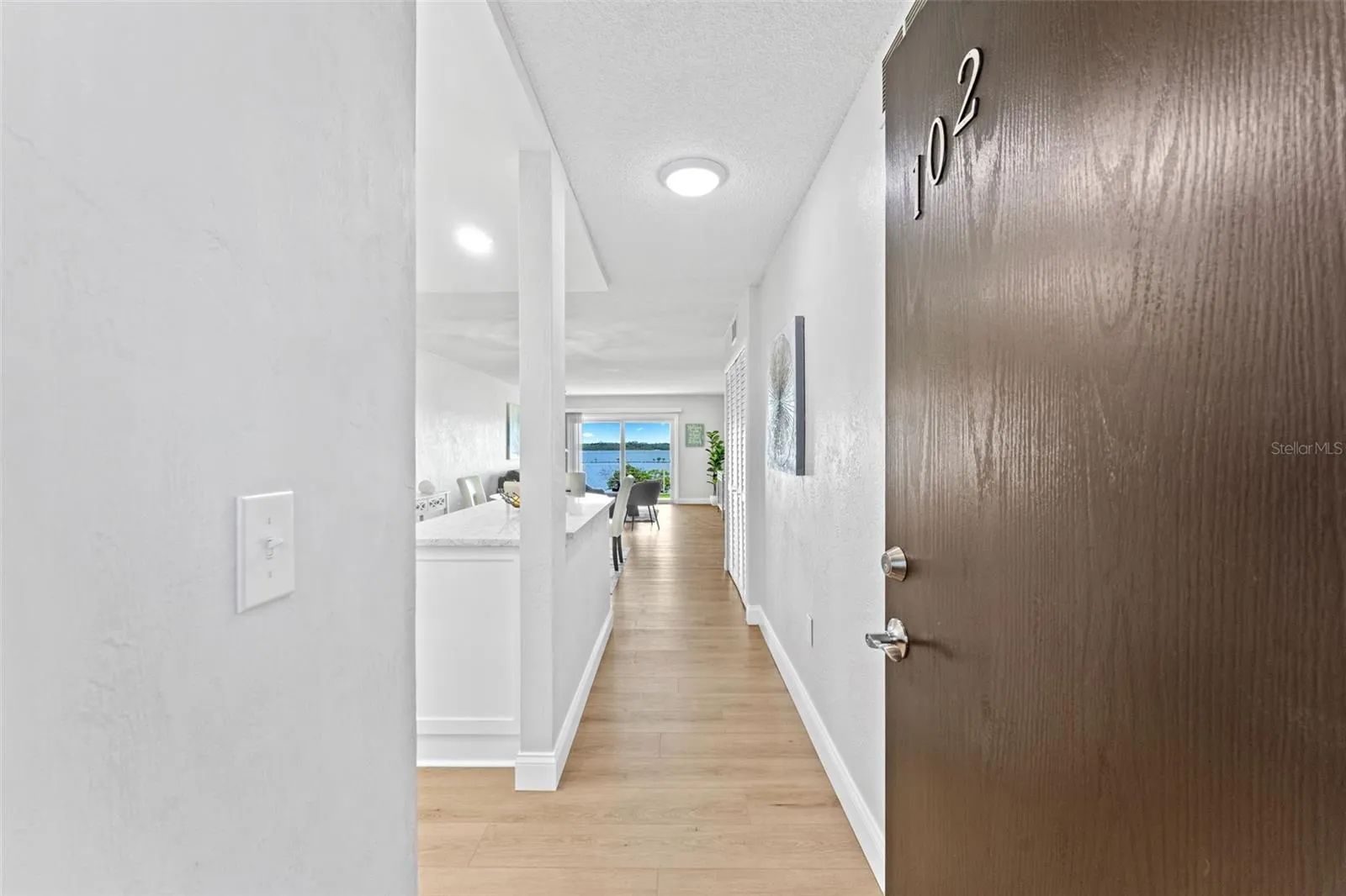 Welcome to unit #102.  Side, lobby and even back patio entry.