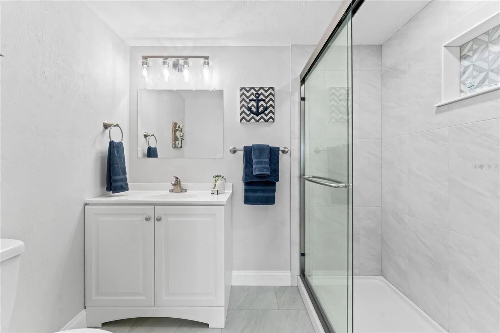 Bathroom with walk-in shower.