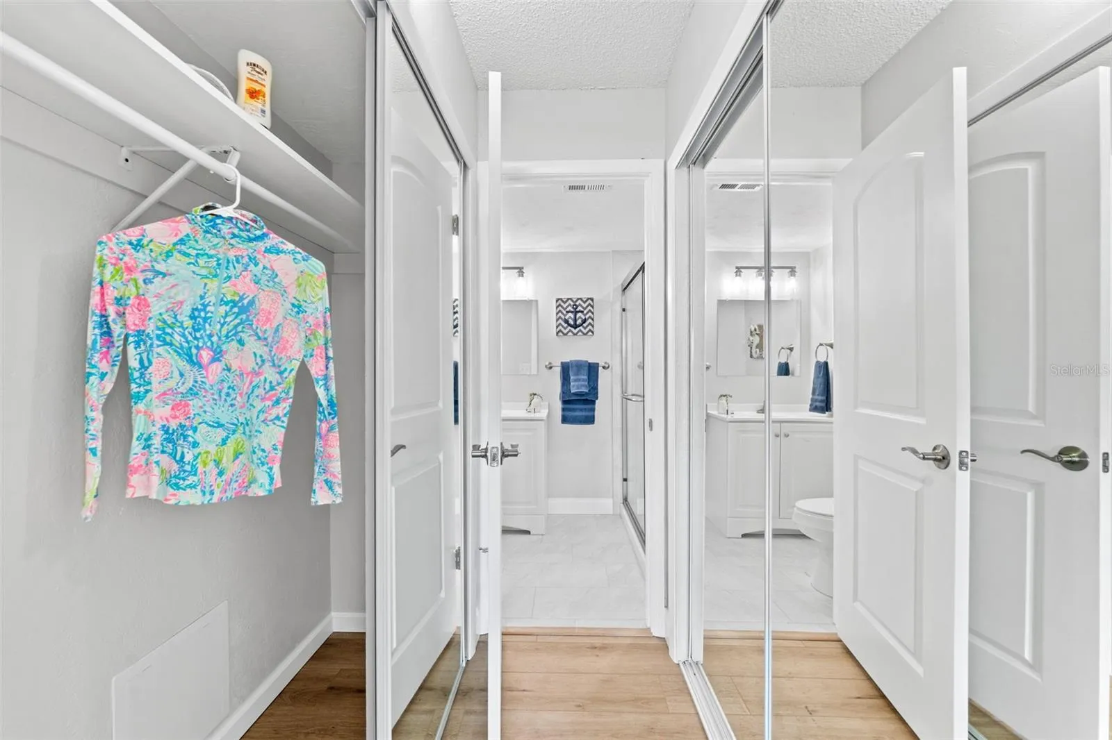 Built in dual closets with new mirrored doors.