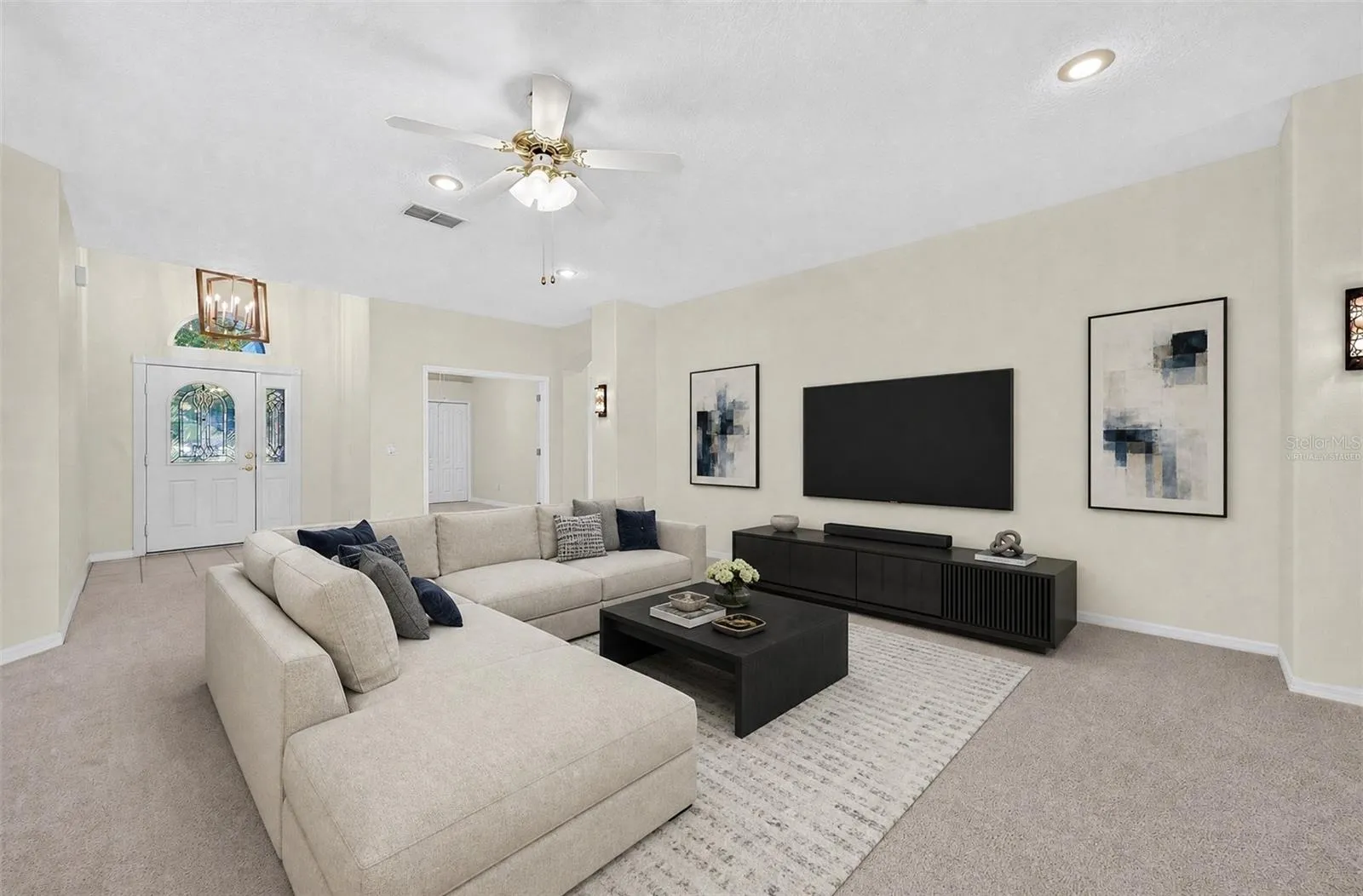 The Living Room offers a COMFORTABLE SPACE for quiet evenings at home or gathering with family and friends. Virtually Staged