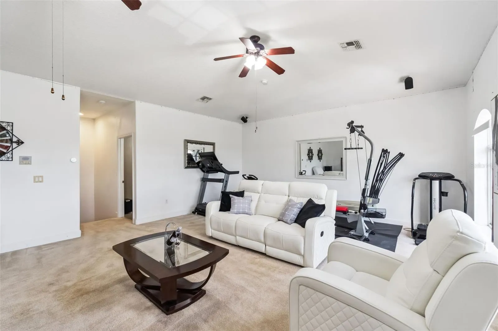 Upstairs loft with space for a home gym, media room or office
