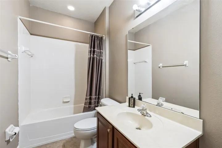 Full bathroom with tub and shower