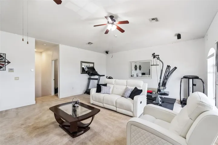 Upstairs loft with space for a home gym, media room or office