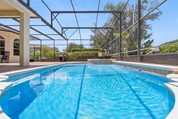 Sparkling screened pool with open views