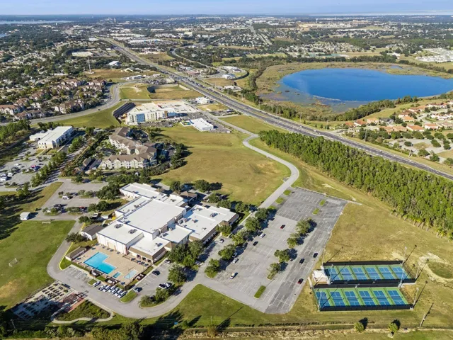 The Legends amenity campus with clubhouse, pool and courts