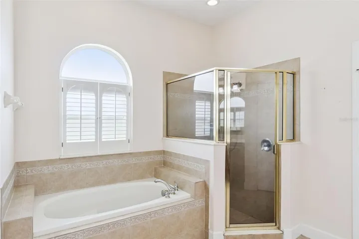 Primary bathroom with garden tub and walk in shower