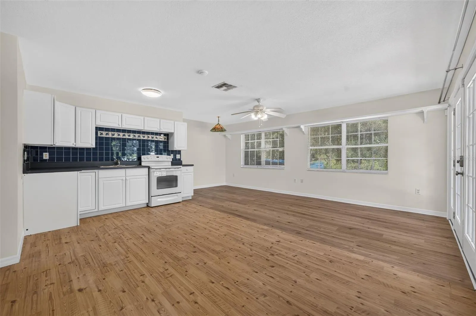 Living room, eat-in space space and kitchenette in in-law suite