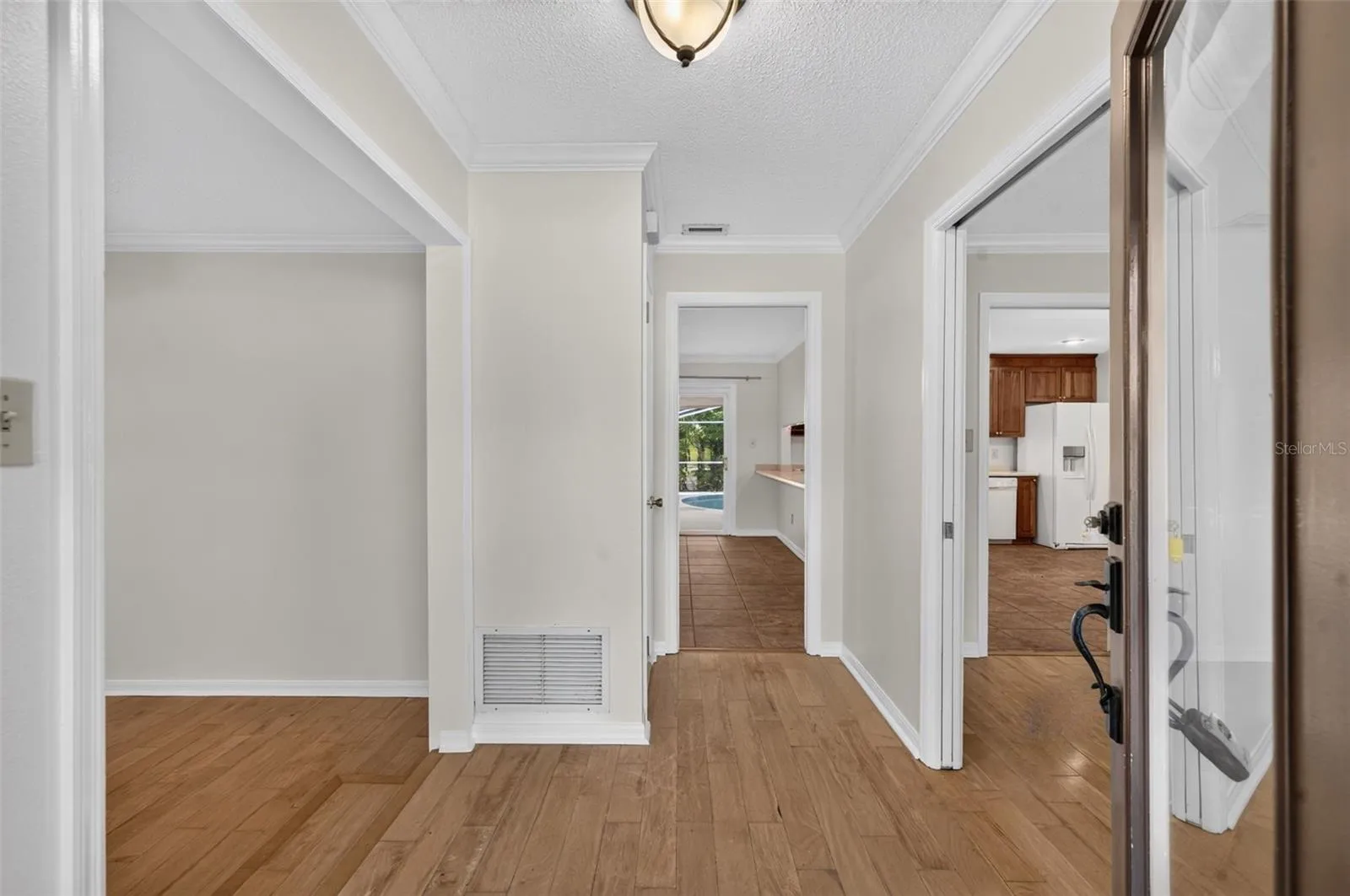 Foyer with living room on left and dining room on the right
