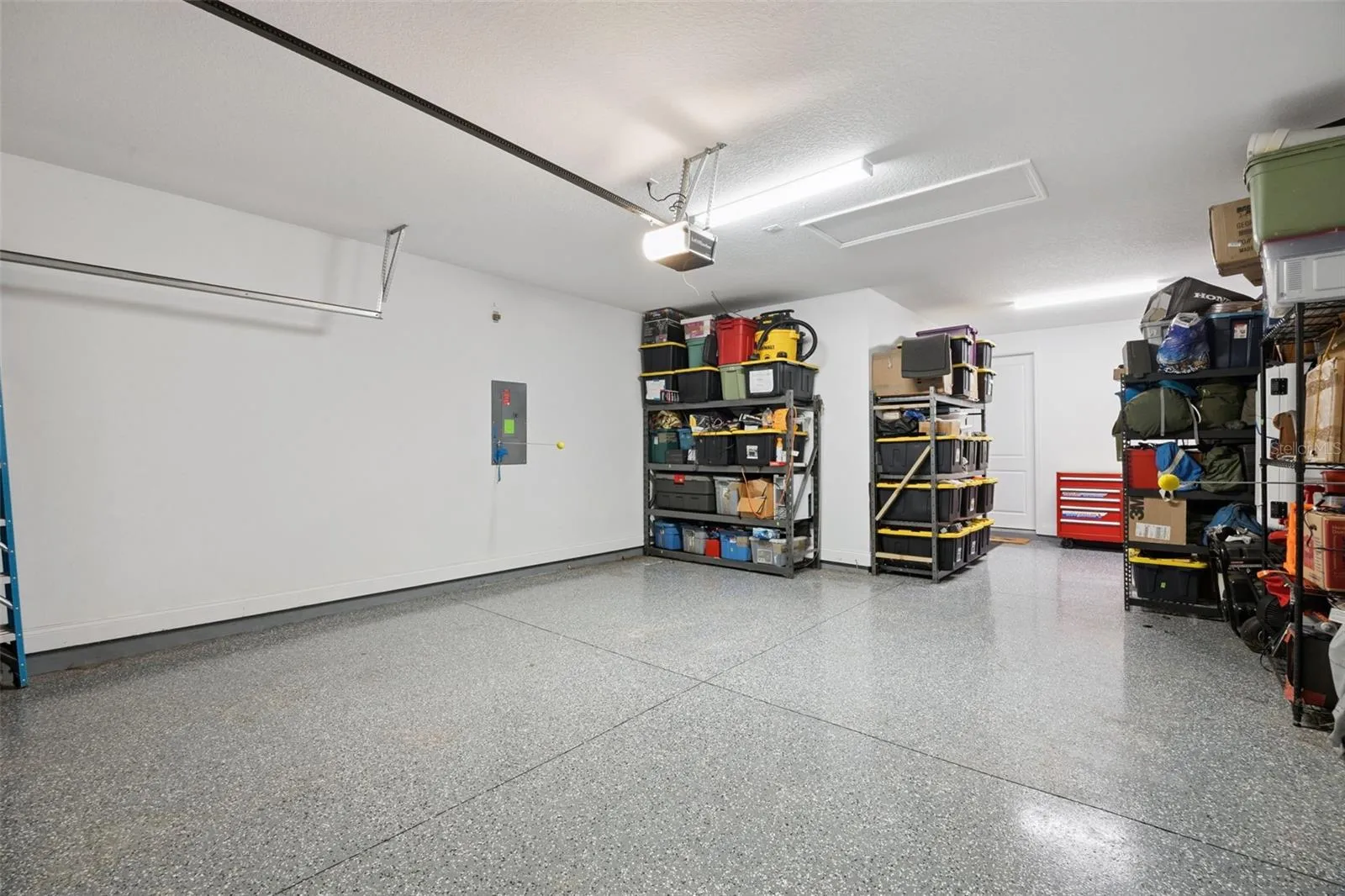 Three Car Tandam Garage with Epoxy Clear Coating.