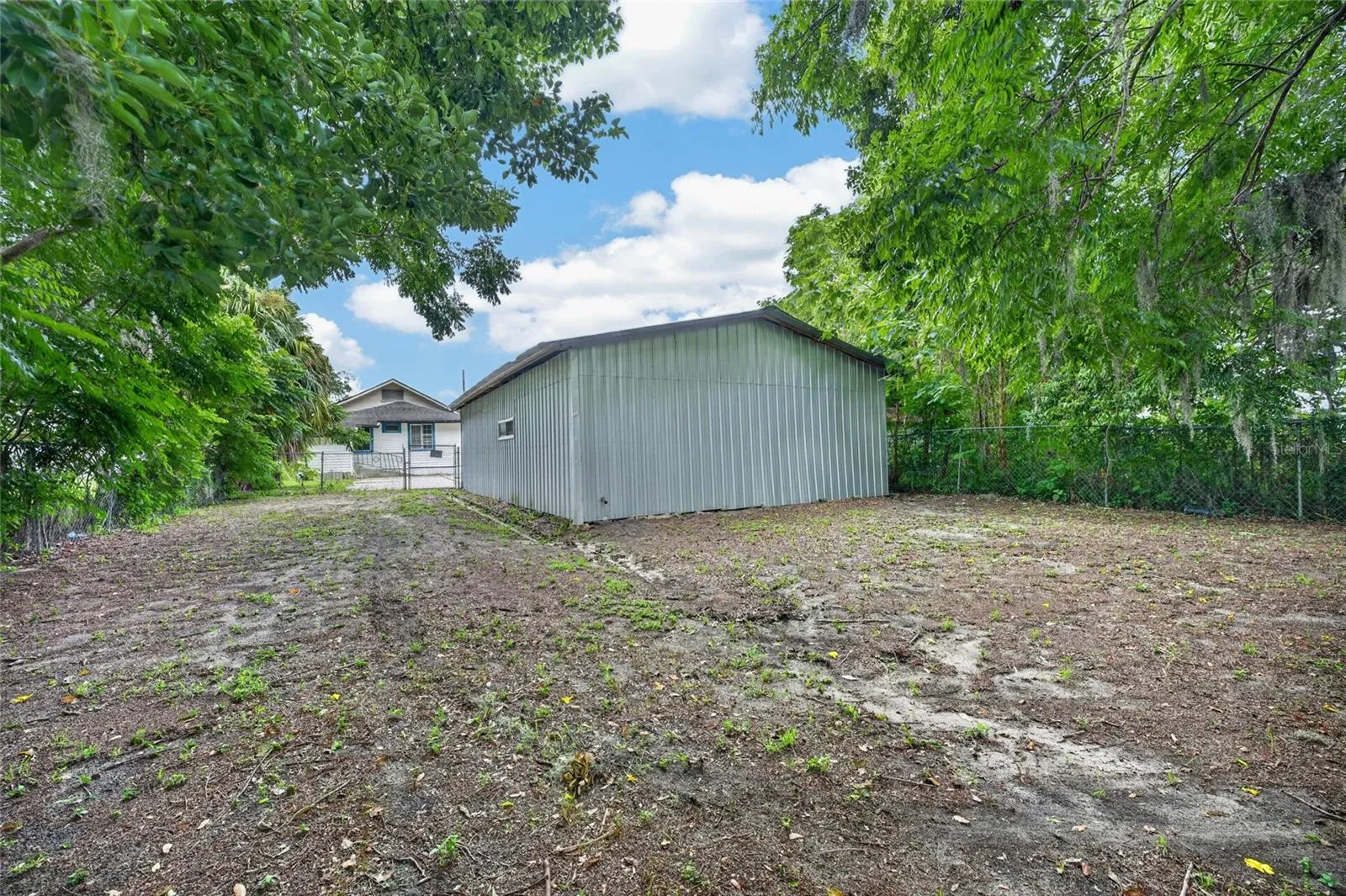 Fenced in rear yard behind two car garage