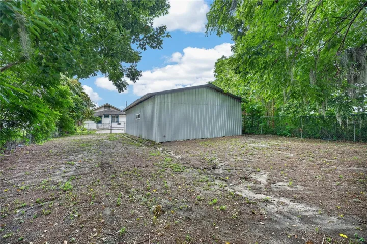 Fenced in rear yard behind two car garage