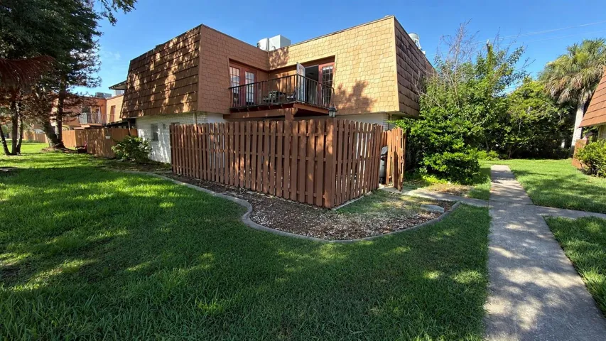 Residential townhouse with landscaped yard