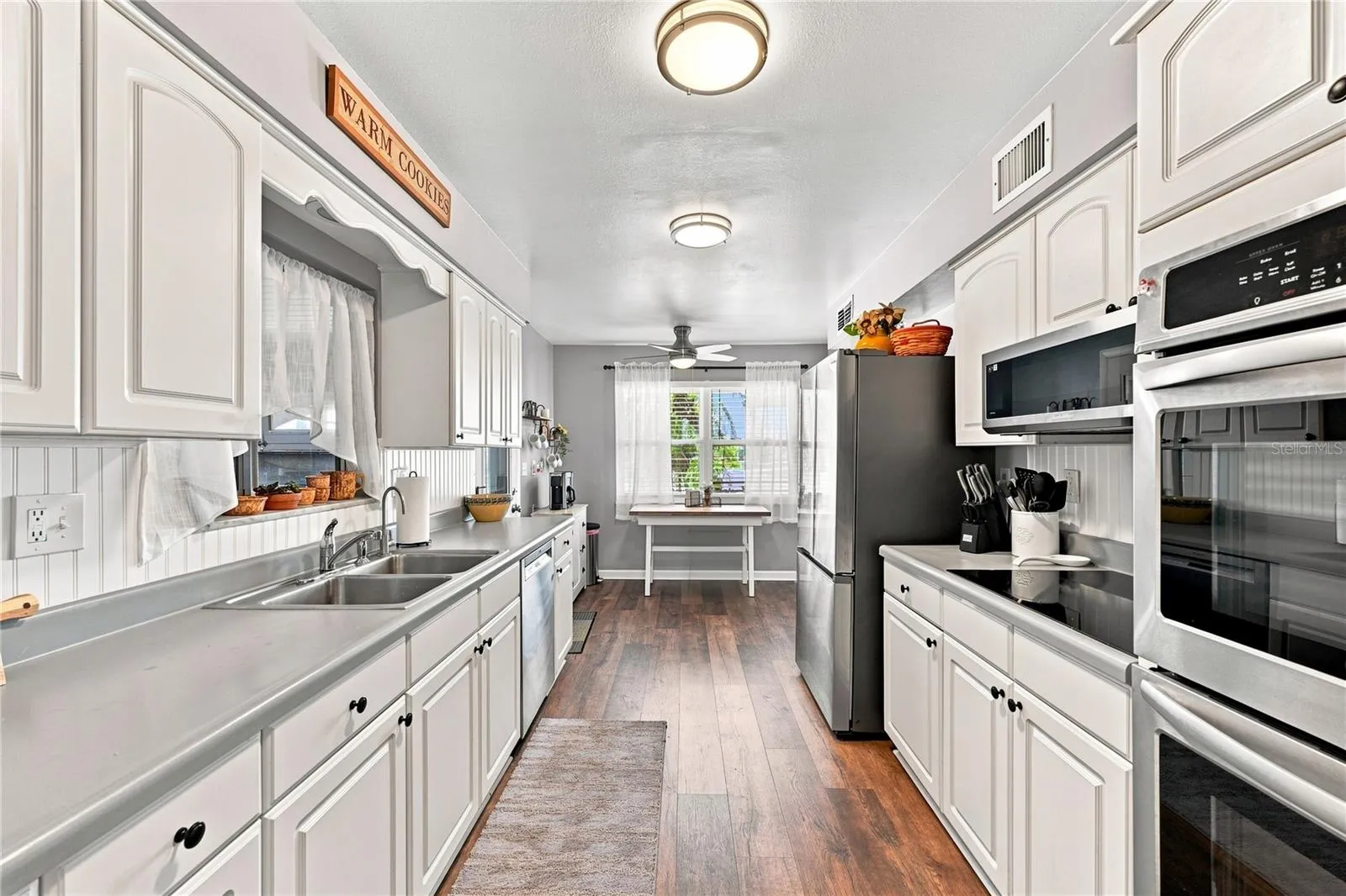 Beautiful LVT Flooring, Updated Efficient Galley Kitchen, New  Fixtures, Interior Repainted, New Refrigerator &amp; Microwave, Double Wall Oven, Coffee Bar, &amp; Eat-In Kitchen