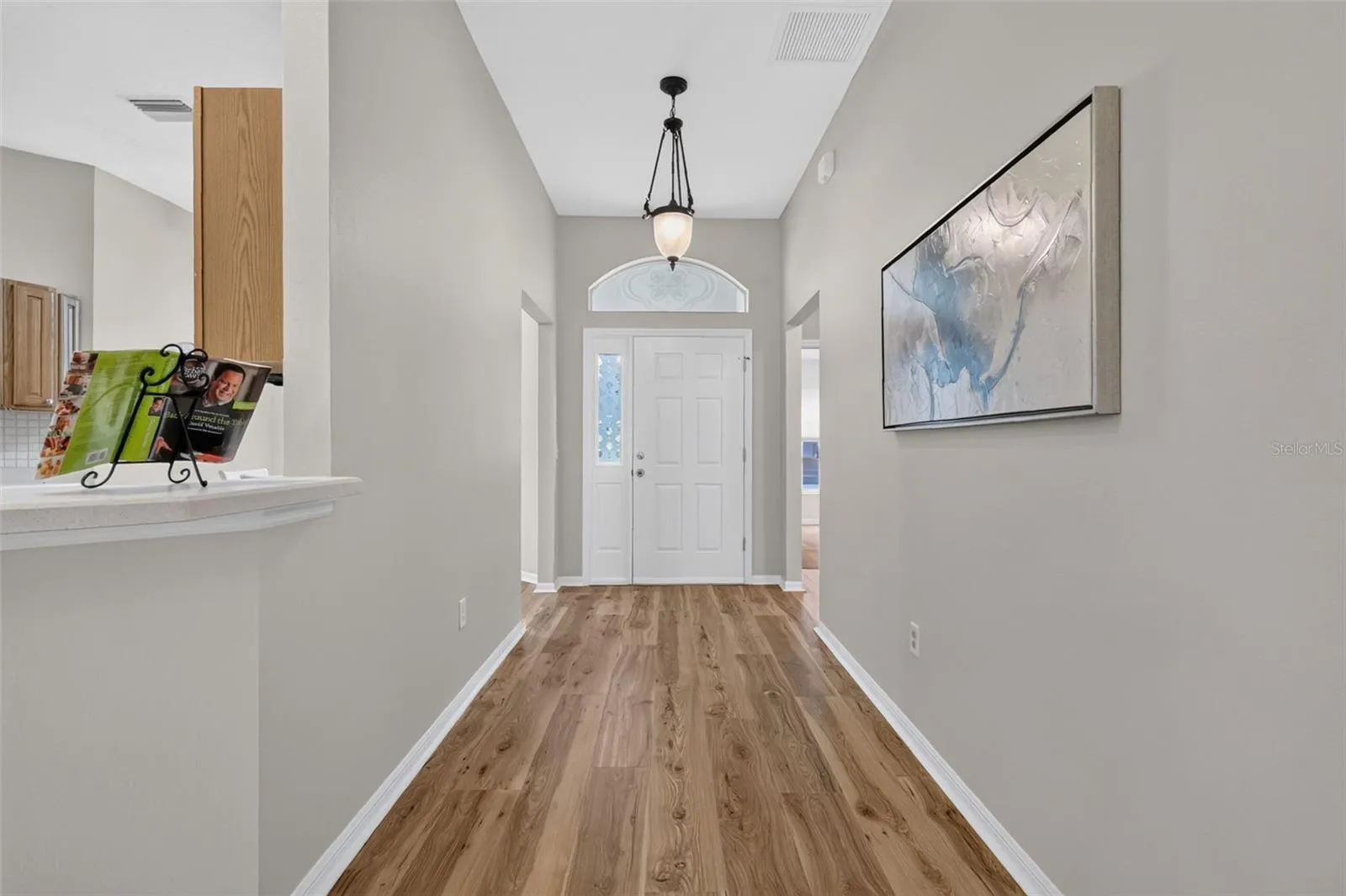 Front hallway with transom window and side lite.