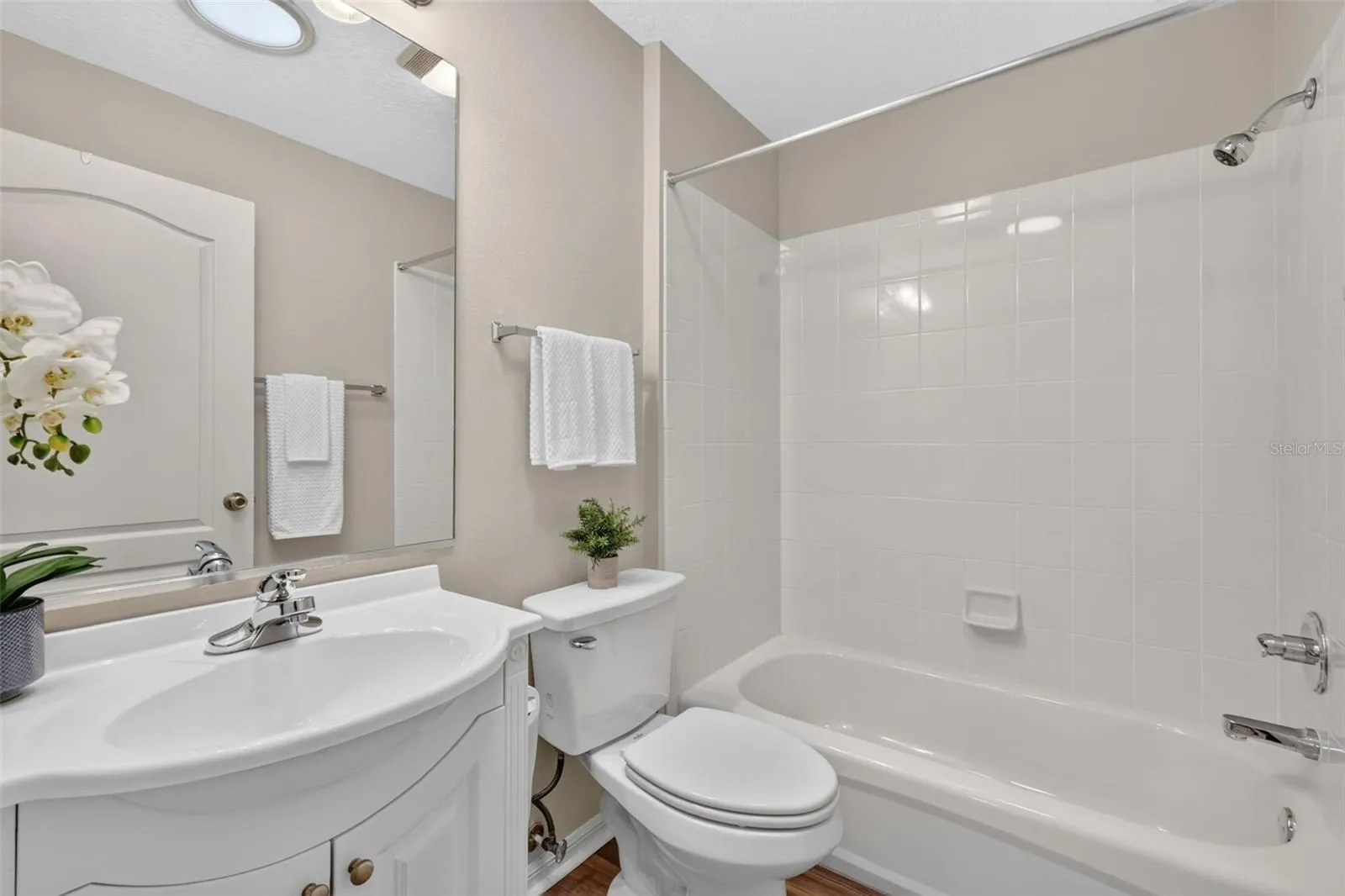 Guest bathroom with Solar Tube, Comfort hight commode, and tub/shower combo.