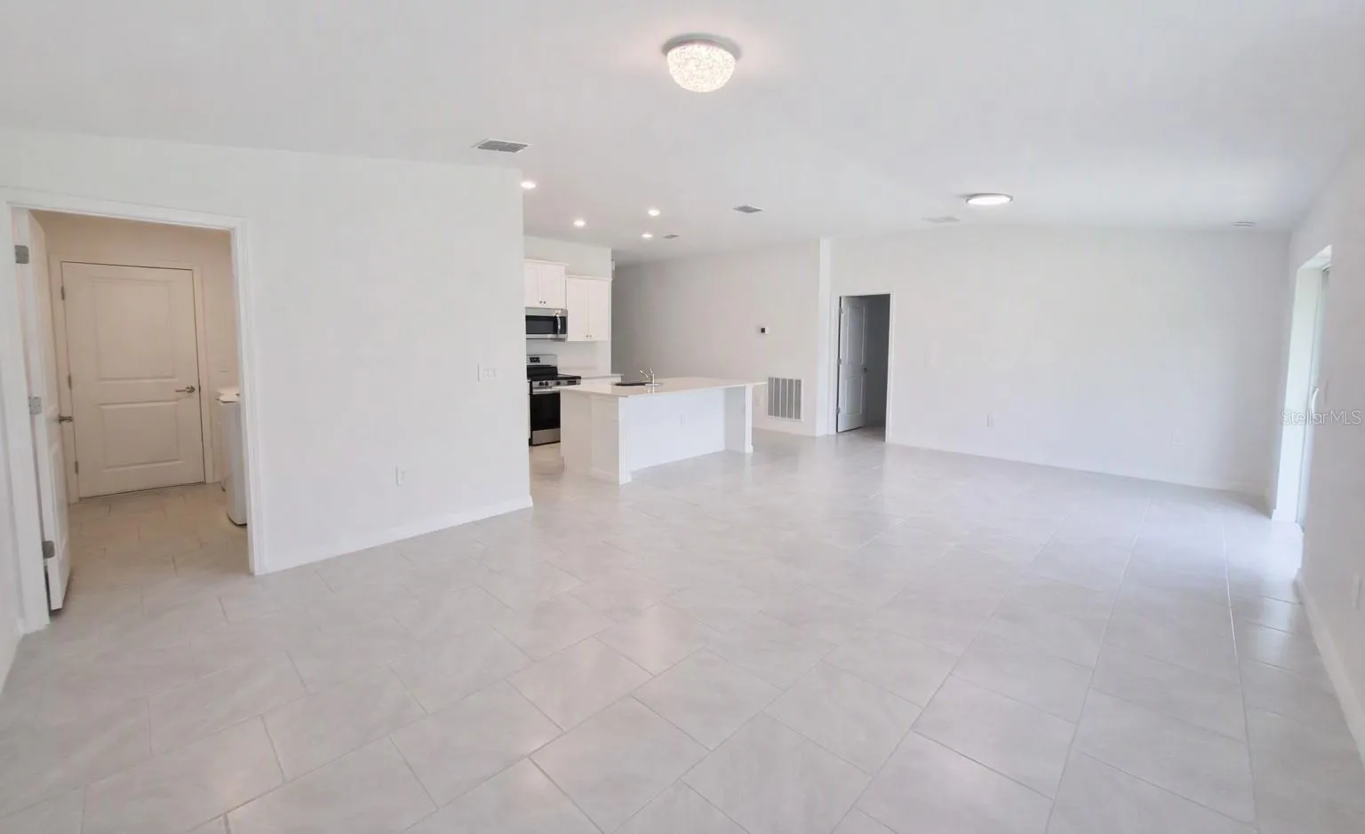 Laundry/kitchen/living room/dining combo