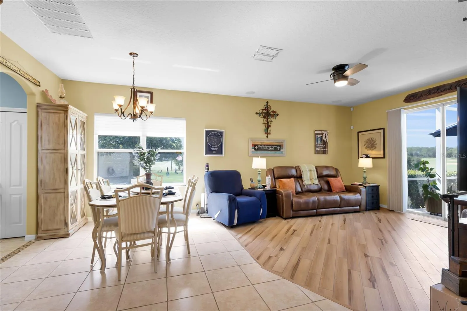 Living Room/Dining Room combo with sliding doors to screened in back porch.