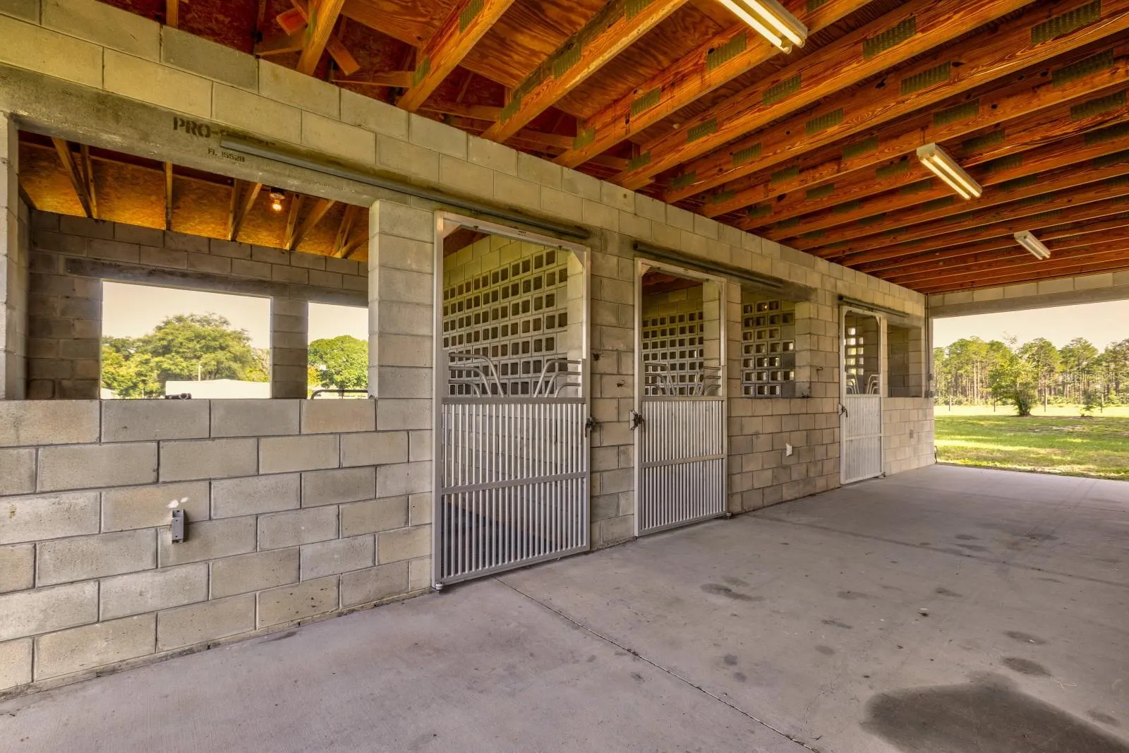 3 Stalls with Aluminum sliding gates and rubber mats, water and electric in each stall