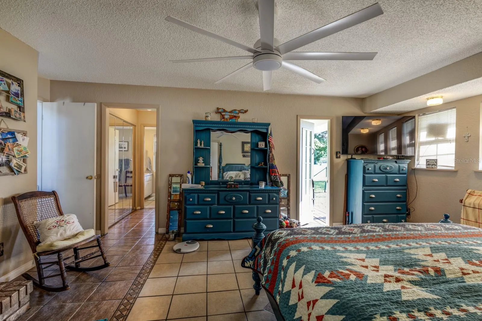 Master Bedroom looking towards Bathroom and an Exterior Door leading to side yard