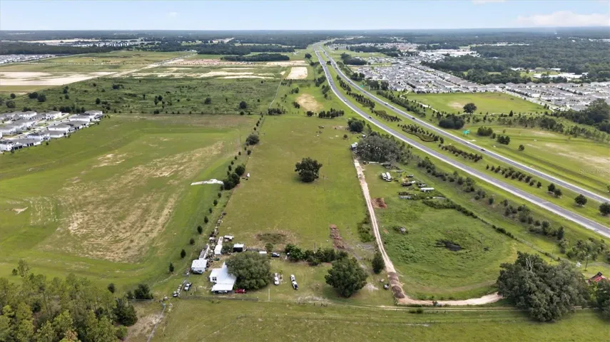 Primary aerial showcasing the contiguous 15± acre property and its strategic location near SR 429 and the Wekiva Parkway