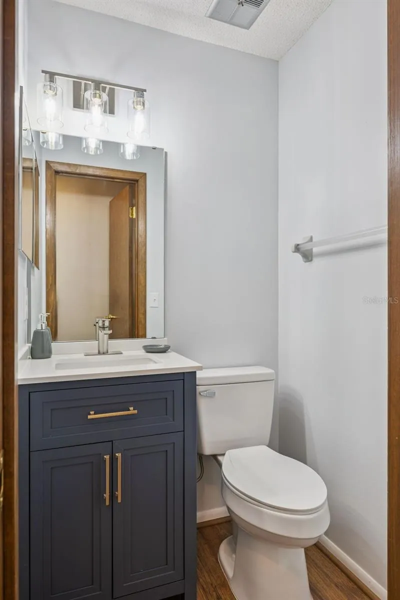 Half a Bath with access to the Covered Lanai and Pool