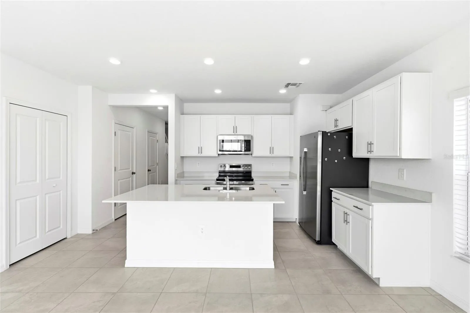view of kitchen from the living room-open concept