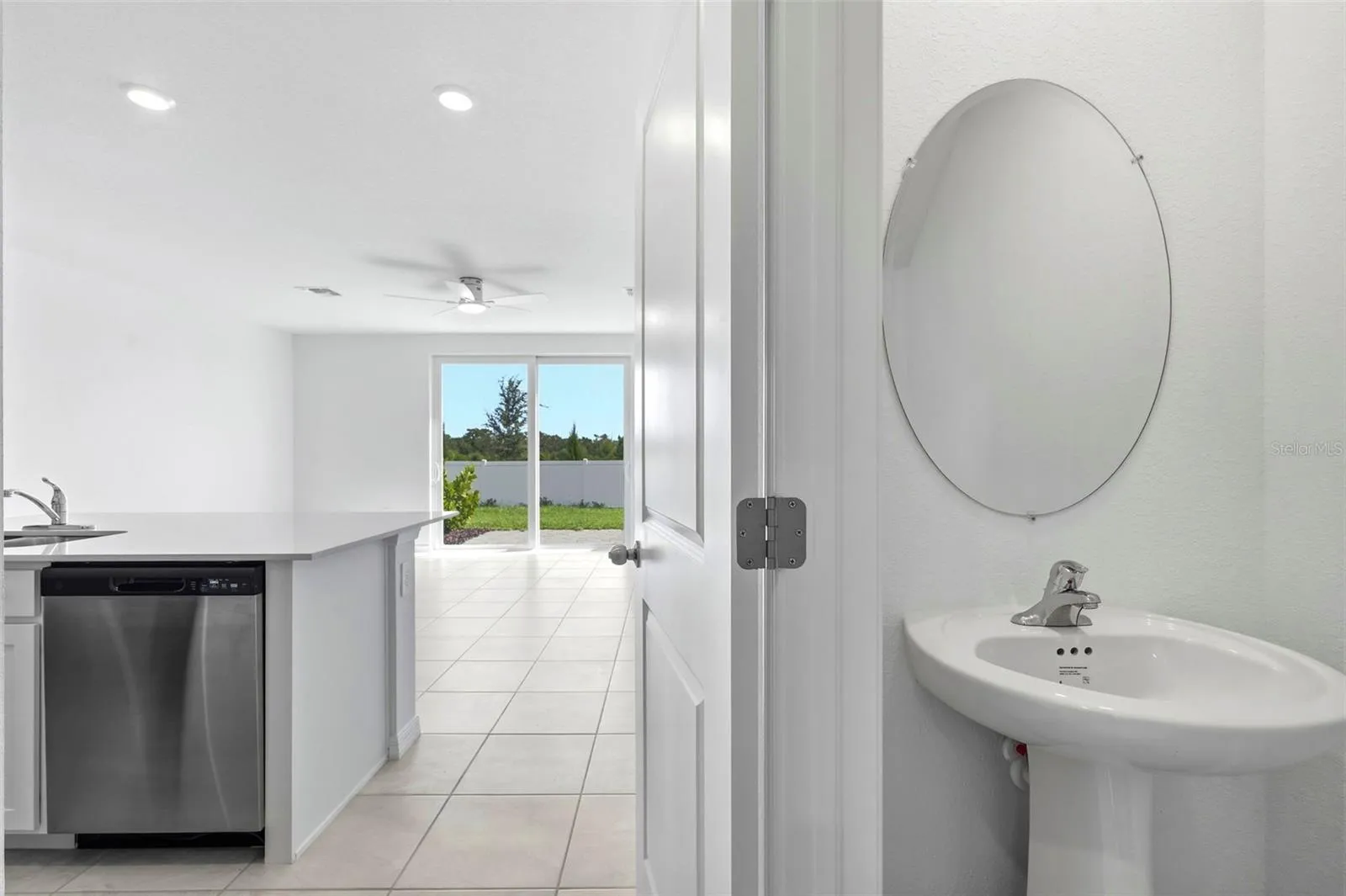view from the hall going into the kitchen and powder room