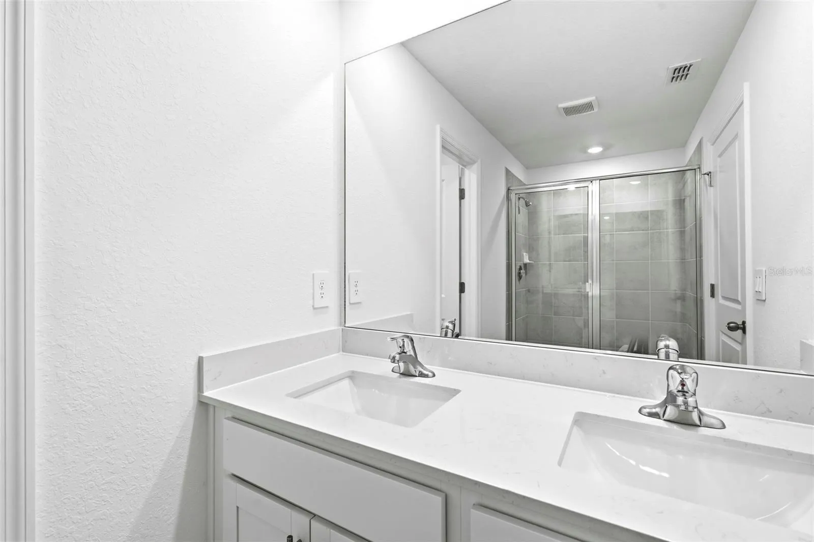 master bathroom with dual vanities