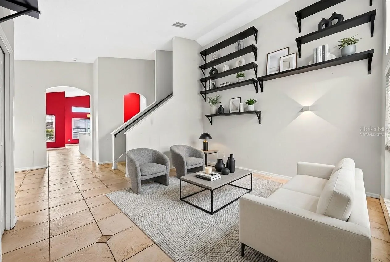 Foyer opens up to versatile formal living and dining spaces. Virtually Staged.