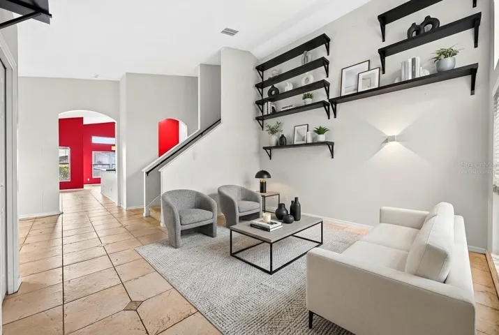 Foyer opens up to versatile formal living and dining spaces. Virtually Staged.