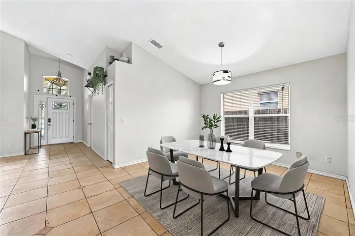 Foyer opens up to versatile formal living and dining spaces. Virtually Staged.