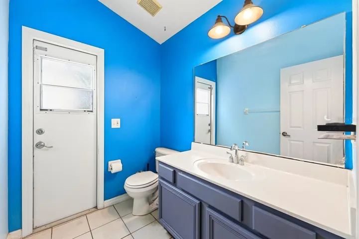 Primary en-suite bath has pool access.