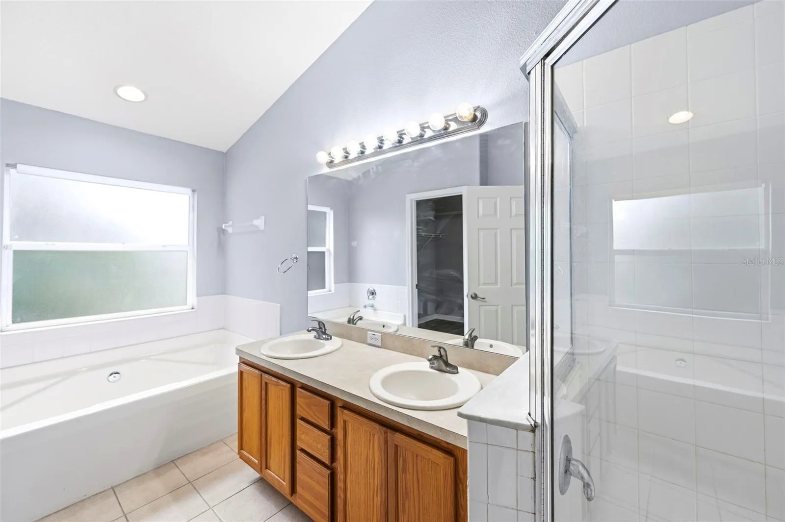 Primary bathroom - dual sinks, walk-in shower, soaking tub