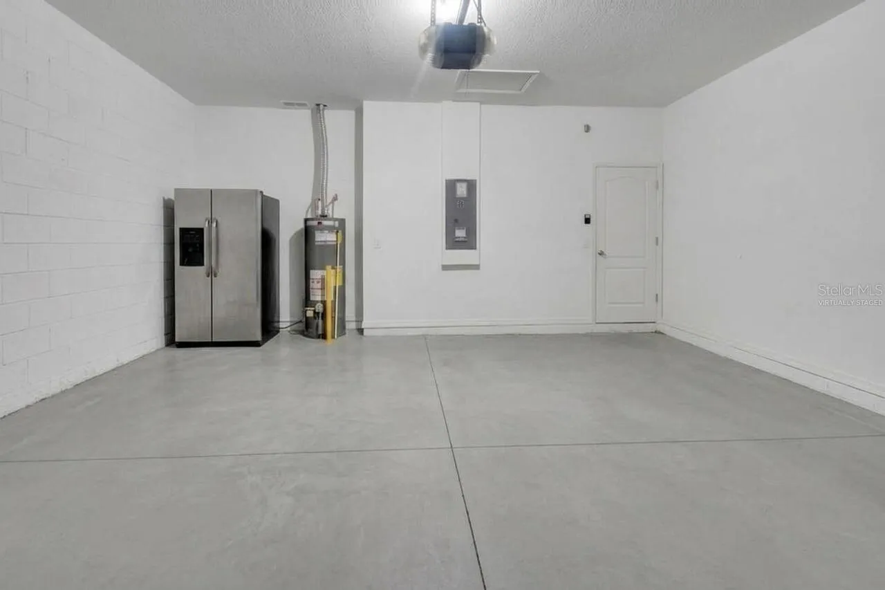 Virtually staged and garage fridge does not convey.