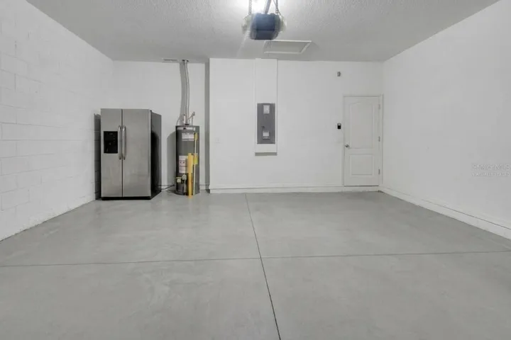 Virtually staged and garage fridge does not convey.