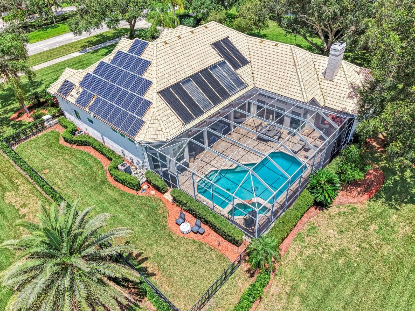 Overhead - fenced dog run, and solar panels power the home, energy stored in Tesla Powerwall