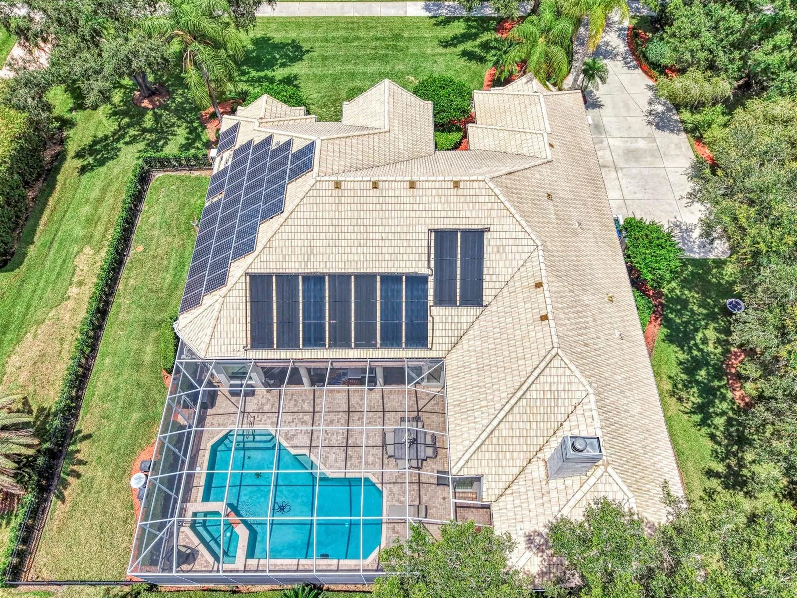 Overhead - fenced dog run on the left, and solar panels power the home, energy stored in Tesla Powerwall
