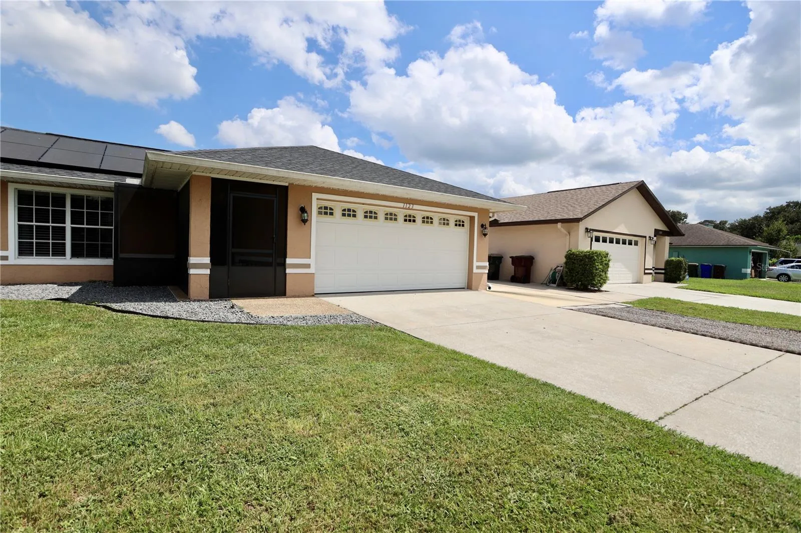 Front of home and extra parking pad