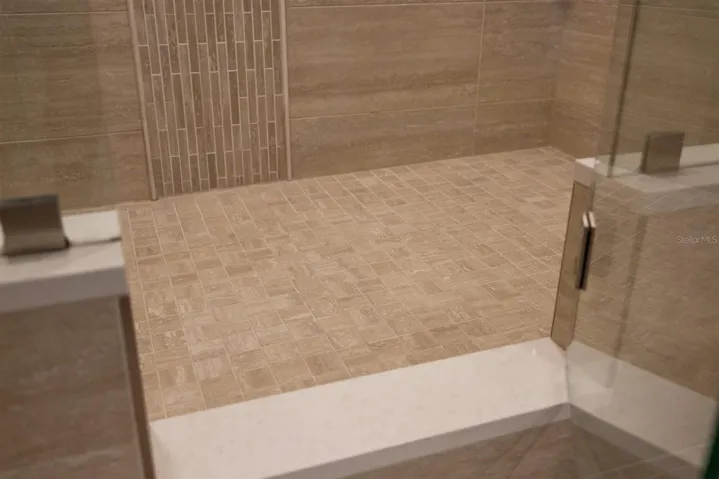 Beautiful tile updates for primary shower and glass door