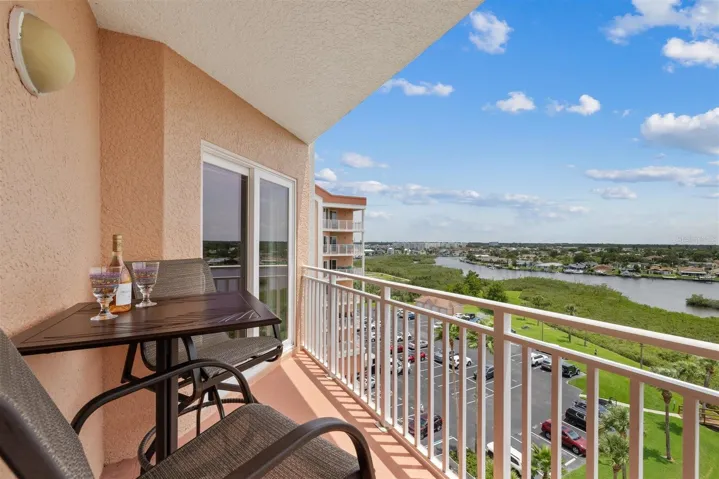 Balcony seating area and great views, looking southeast-sliders lead to primary suite