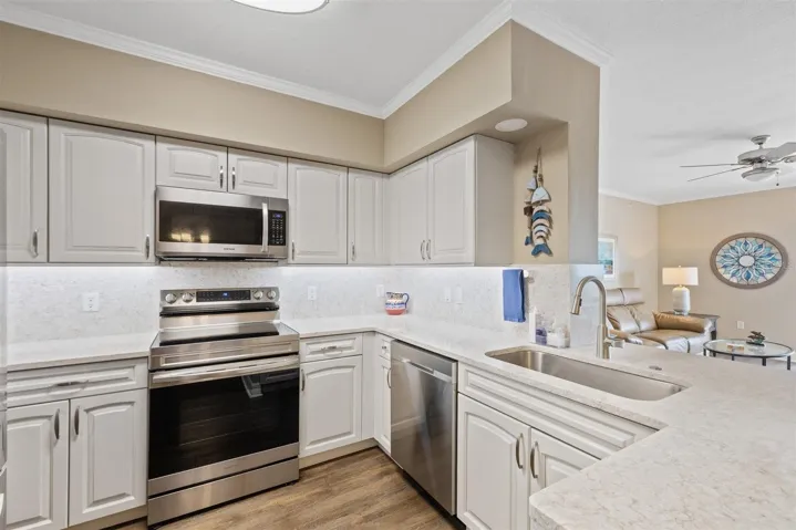 Stainless appliances and updated cabinetry with slide outs.