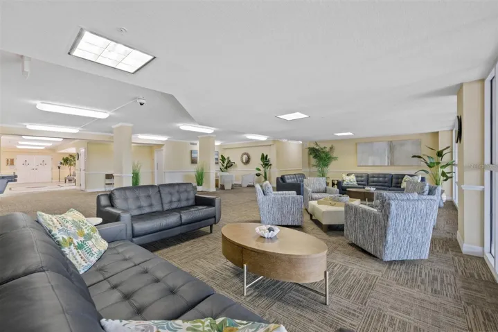 2nd floor-new furniture in seating area overlooking covered entryway with dolphin fountain