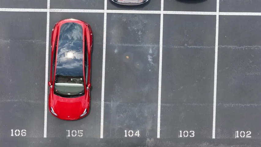Oversized Parking spot #104 assigned with unit near back entrance