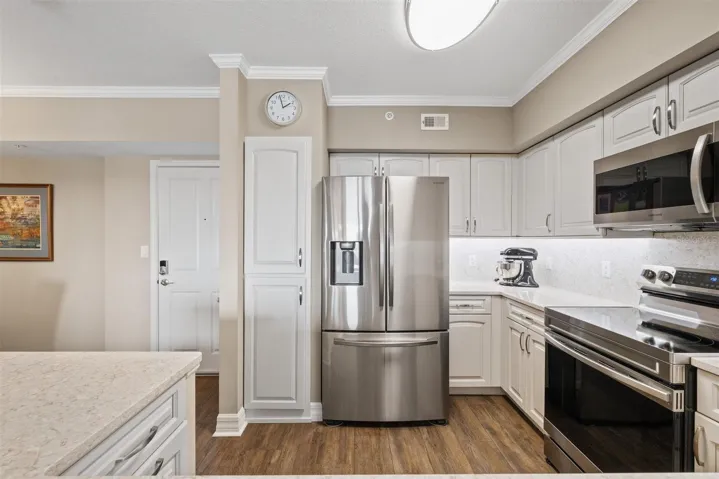 Quality appliances and slide out drawers in cabinetry for ease.