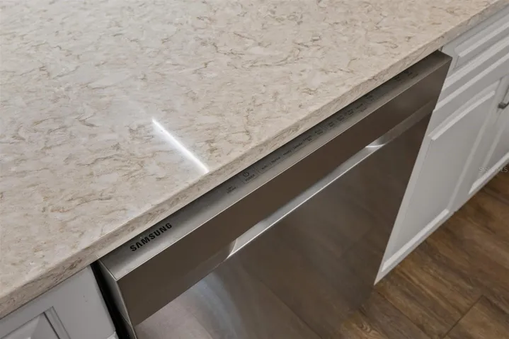 Granite countertops above stainless steel dishwasher