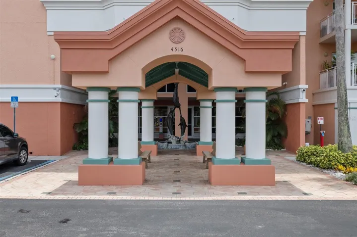 Front entry of complex with dolphin fountain